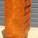 Dark chest of drawers with 5 drawers from the 1950s