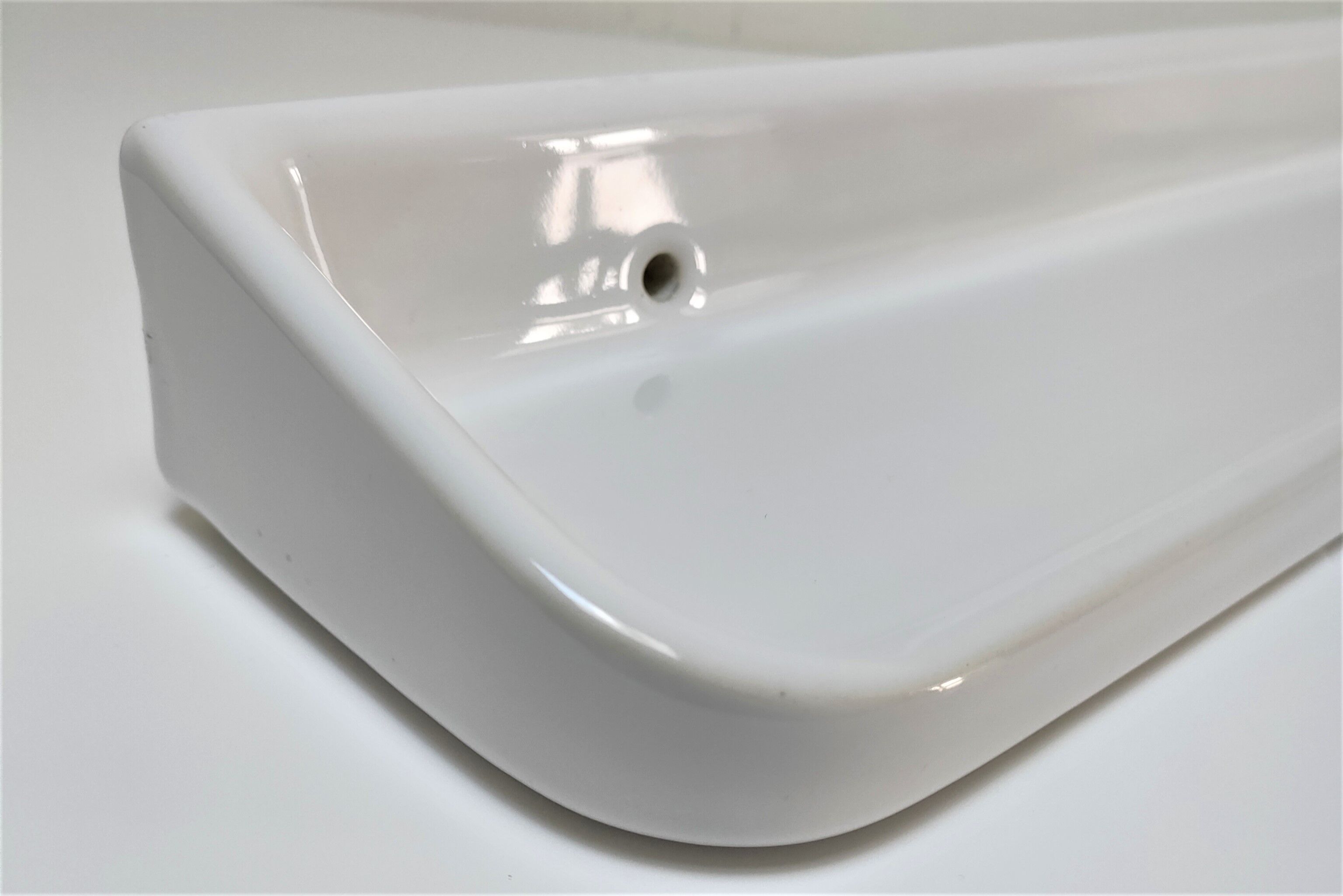 Vintage white glazed ceramic wall shelf