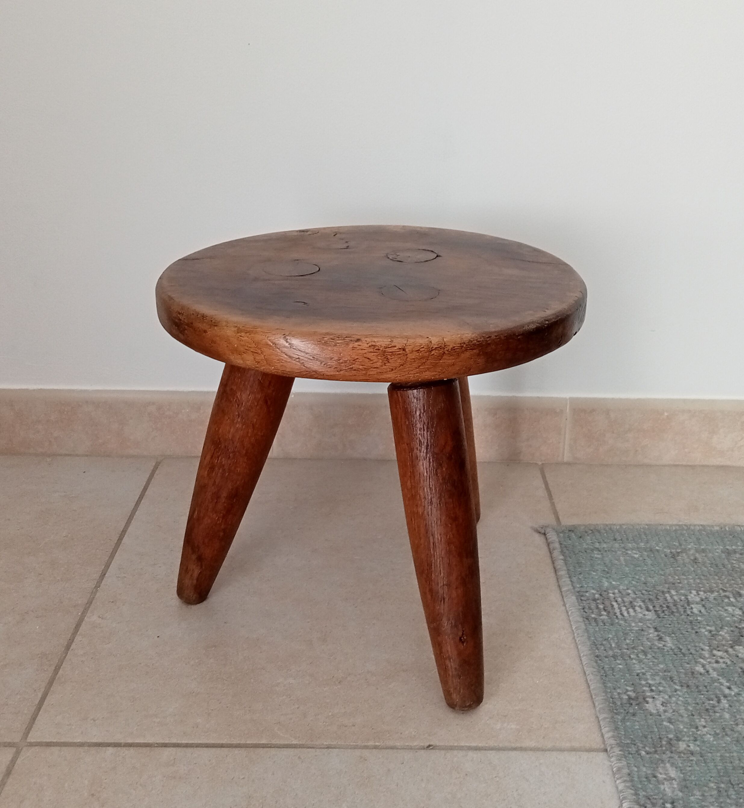 Antique walnut milking stool