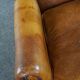 Wingback chair made of sheepskin leather in a light honey color