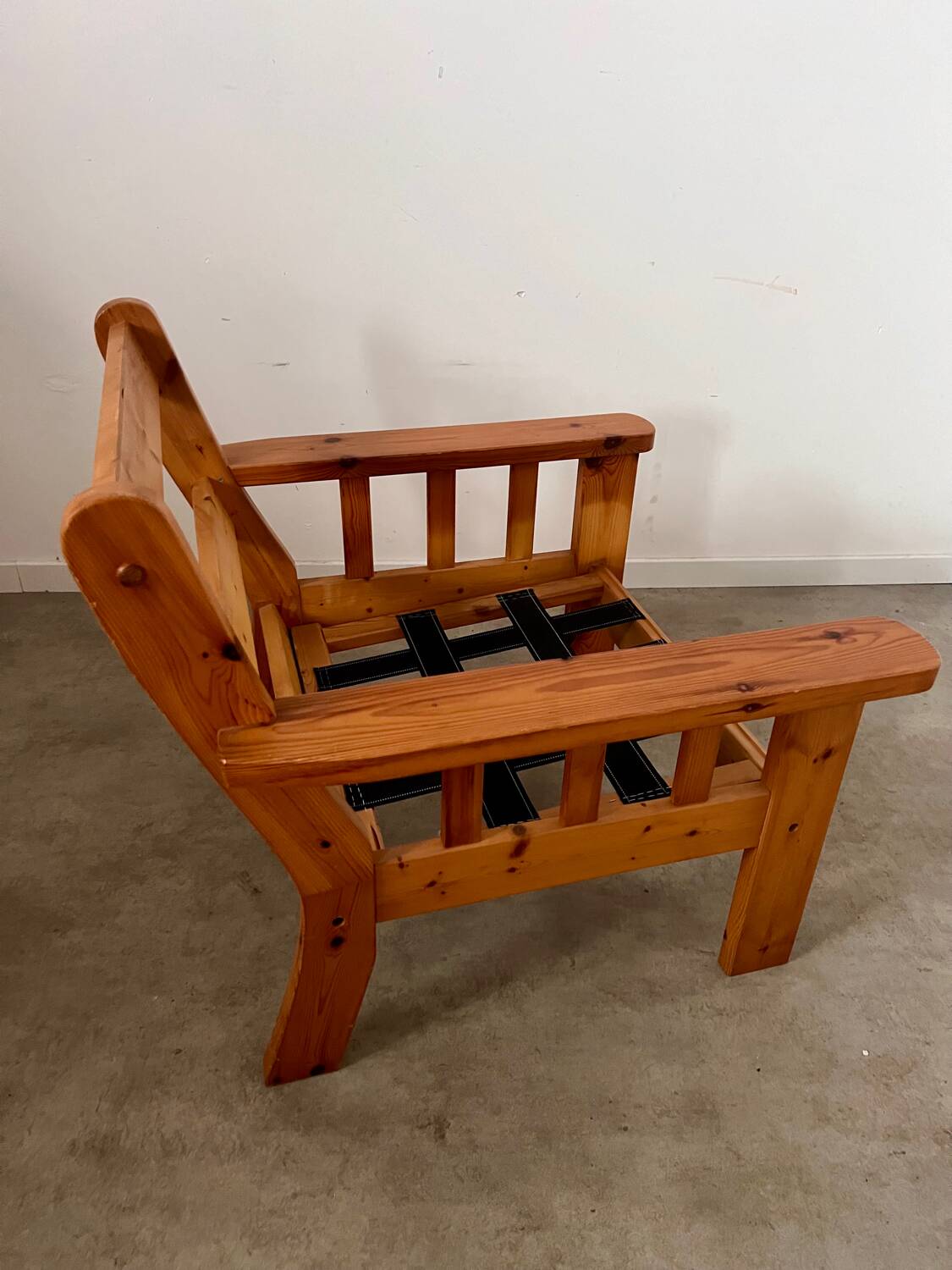 Old vintage Scandinavian design pine armchair from the 70s