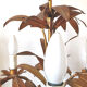 Golden metal chandelier palm leaves