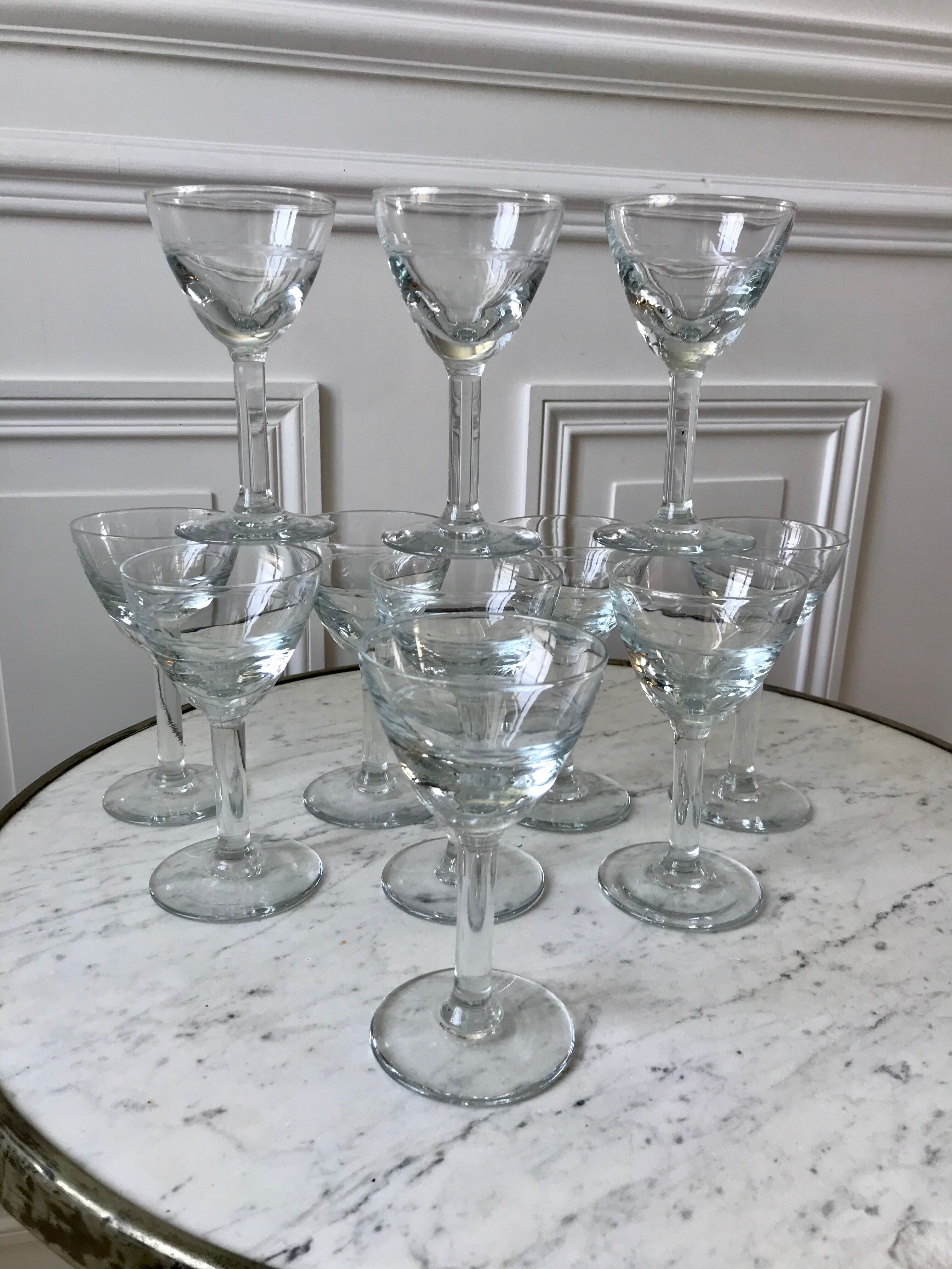 Set of 11 molded glass wine glasses engraved 20s