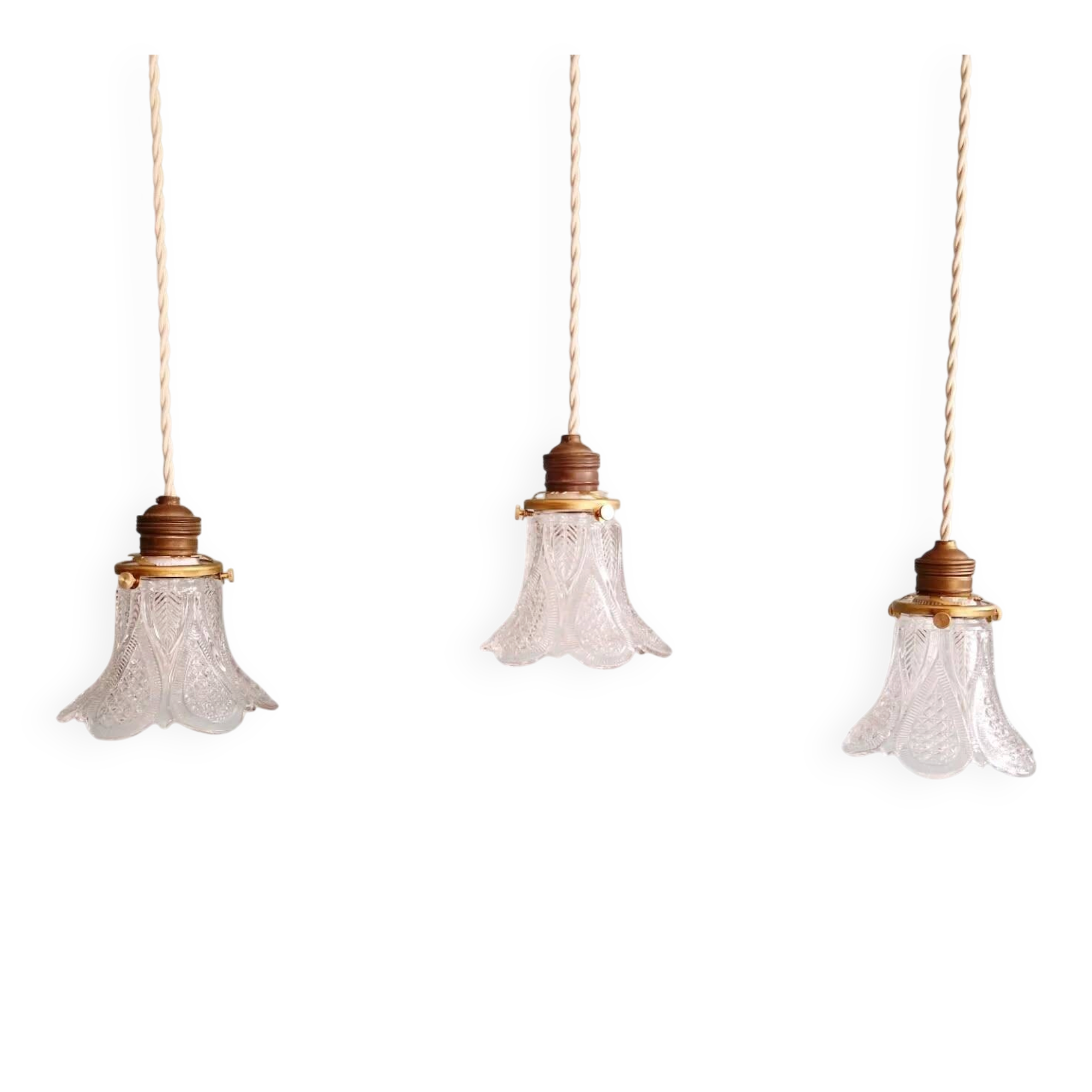 Art Deco trio of pendant lights/table lamps in clear glass, 1920s-30s.