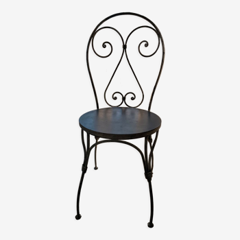 Chair in wrought iron and wood