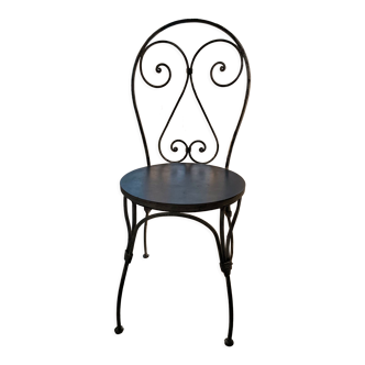Chair in wrought iron and wood
