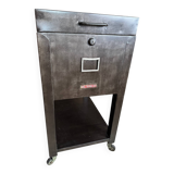 Old vintage industrial filing cabinet on wheels