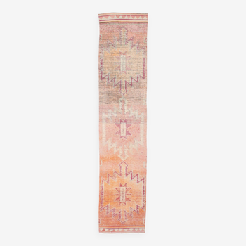 2x12 shades of pale orange vintage runner rug