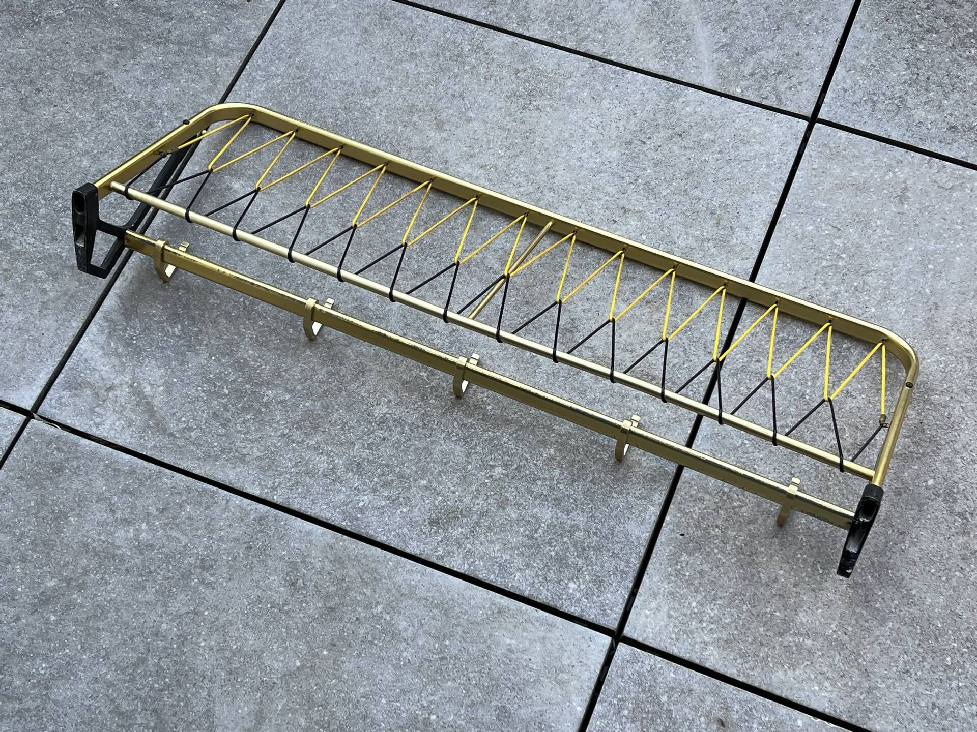 Coat rack in the style of a train luggage rack, length = 79 cm.