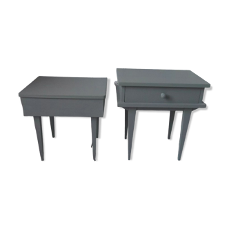 Duo of bedside tables, mismatched vintage sofa ends green of gray