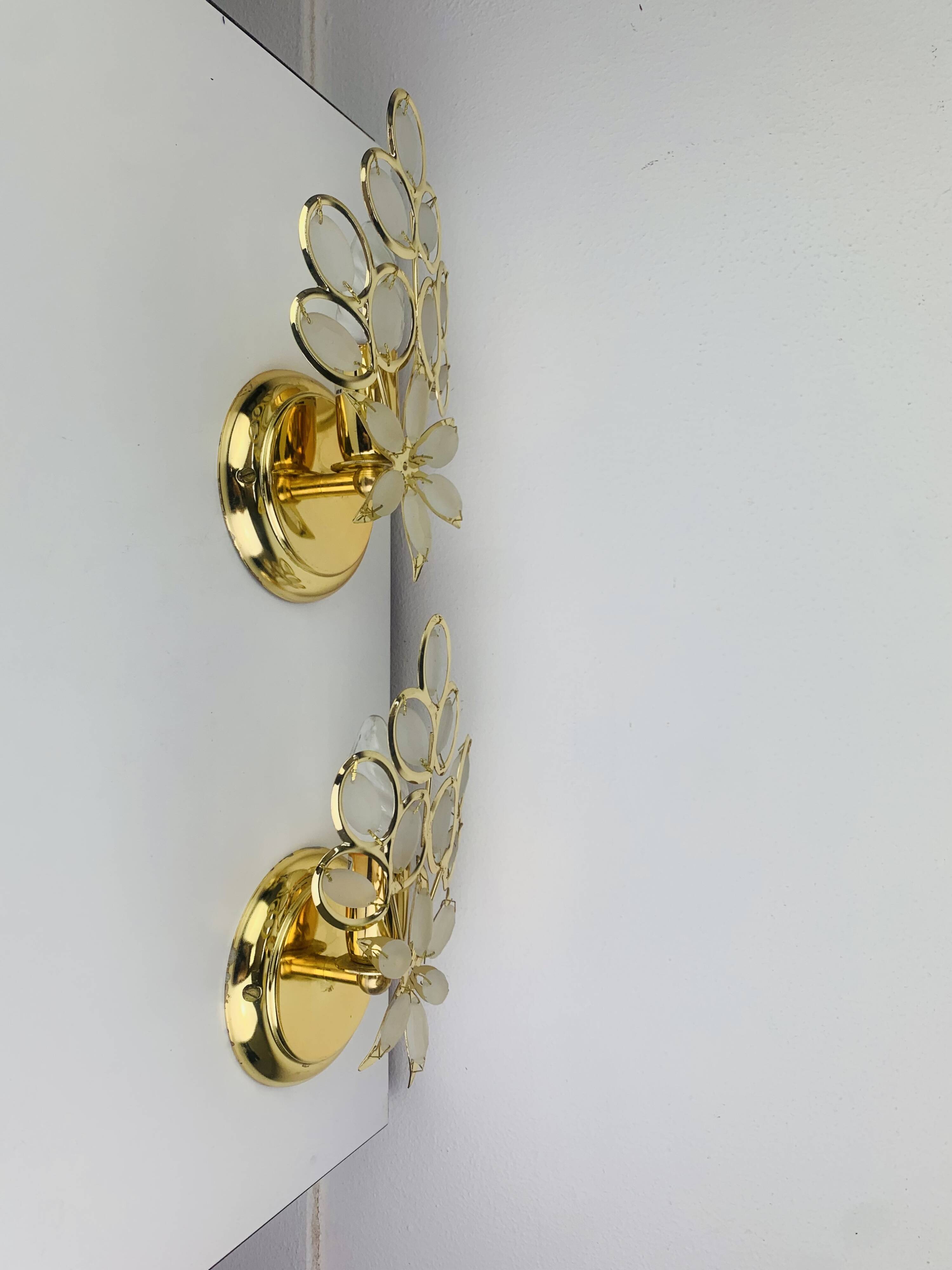 Pair of Hollywood Regency wall lights with glass and gold metal pendants Mathias