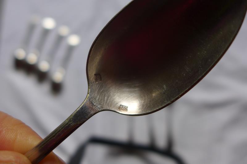 10 small silver spoons