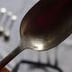 10 small silver spoons