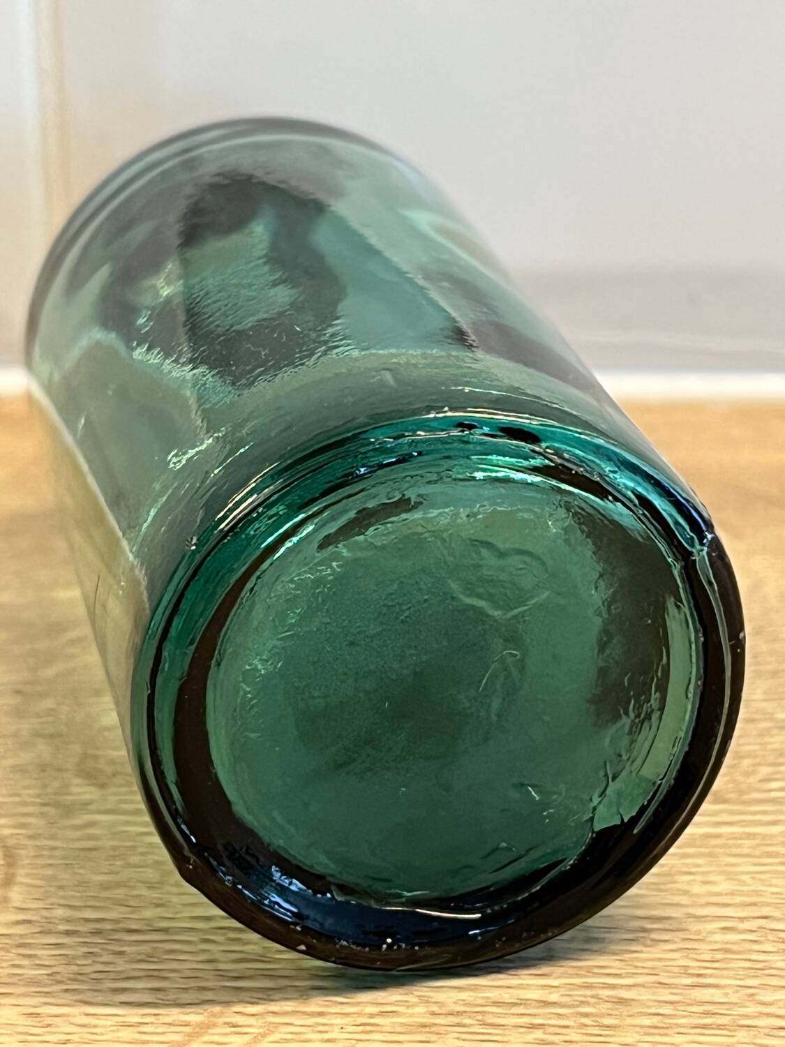 Small vintage dark turquoise blue bottle