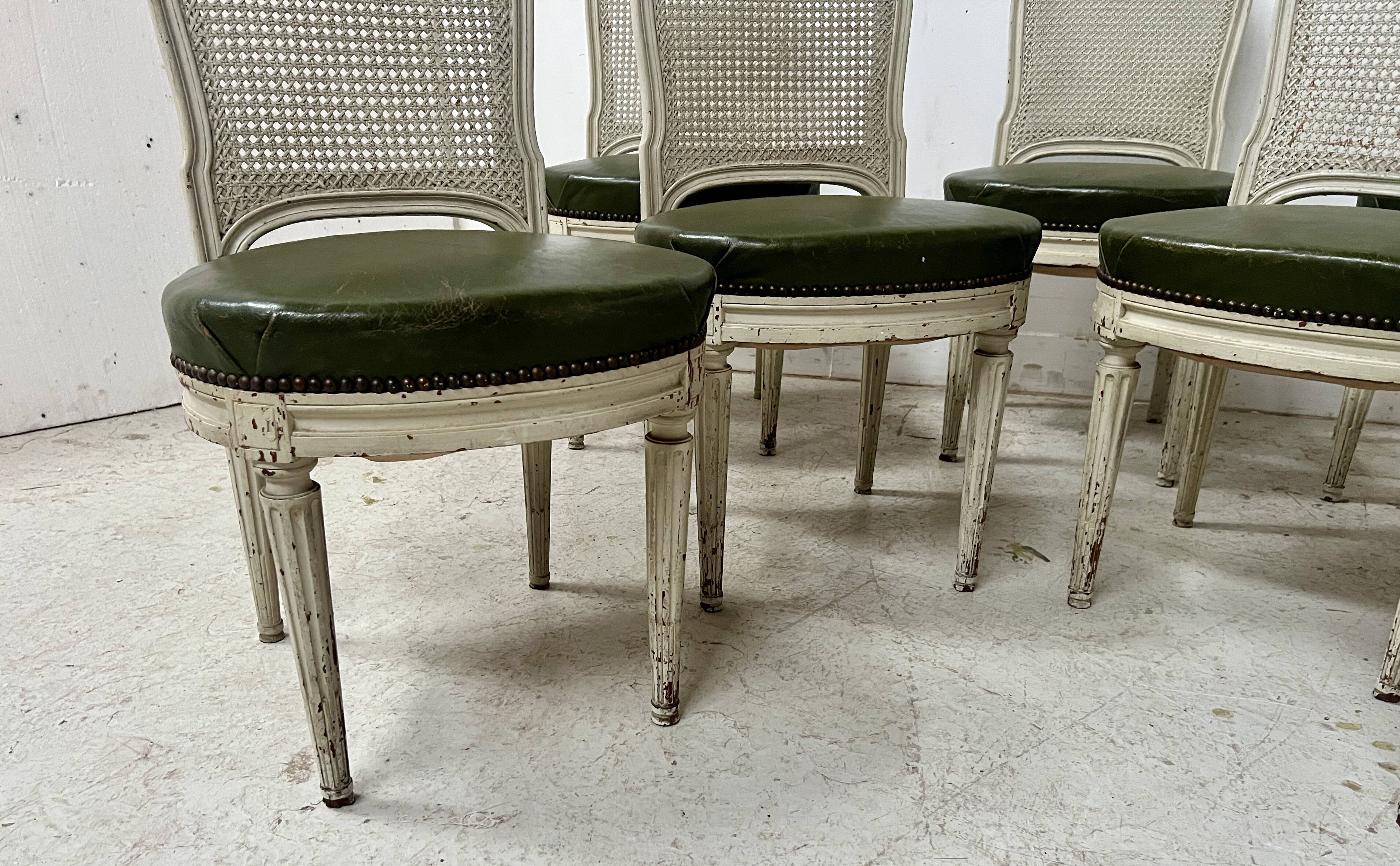 Set of seven Louis XVI style chairs in patinated beech, 20th century.