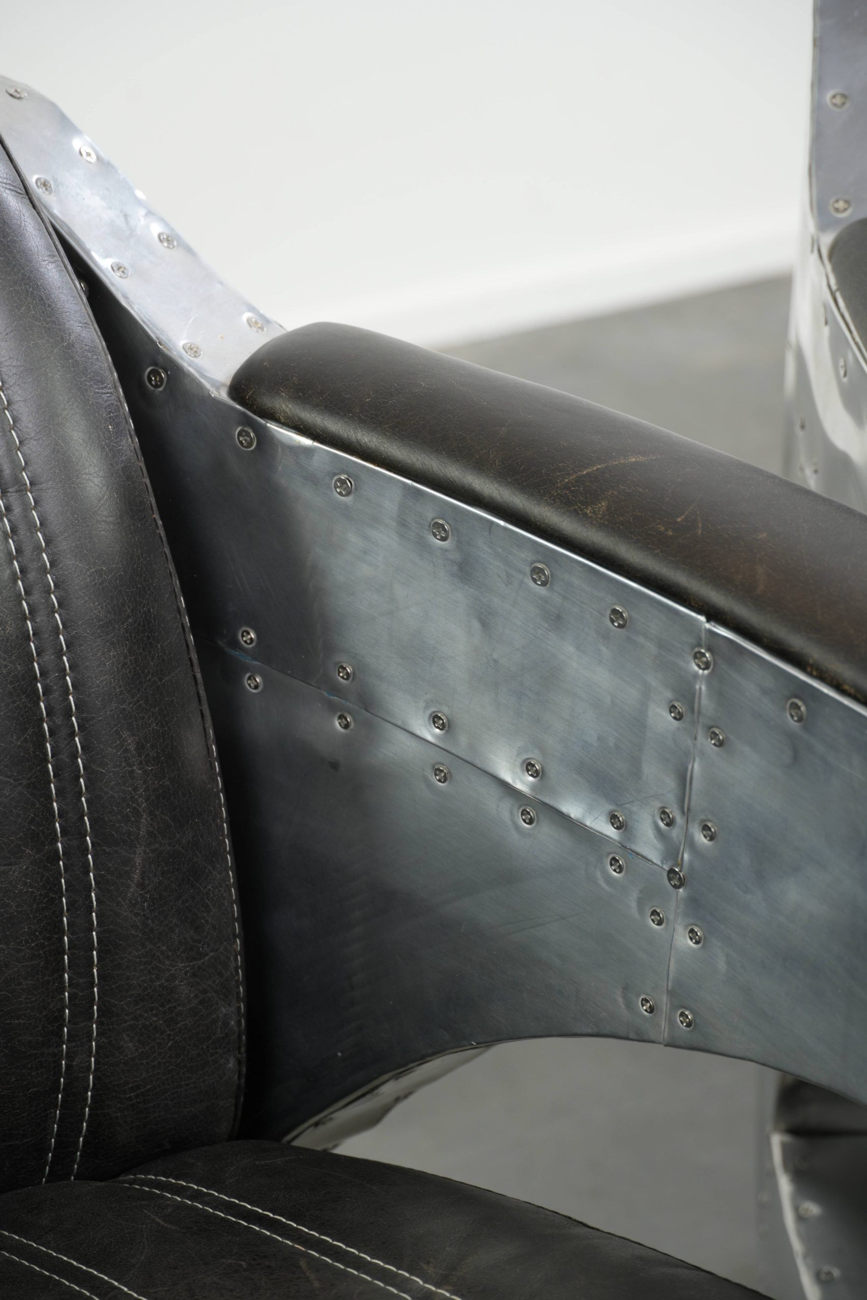 Set of 2 sturdy industrial black cowhide Aviator design armchairs with aluminium and rivets
