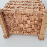 Vintage wicker basket on wheels - children's toy trolley