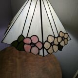 Tiffany-style stained glass lampshade with floral motifs.