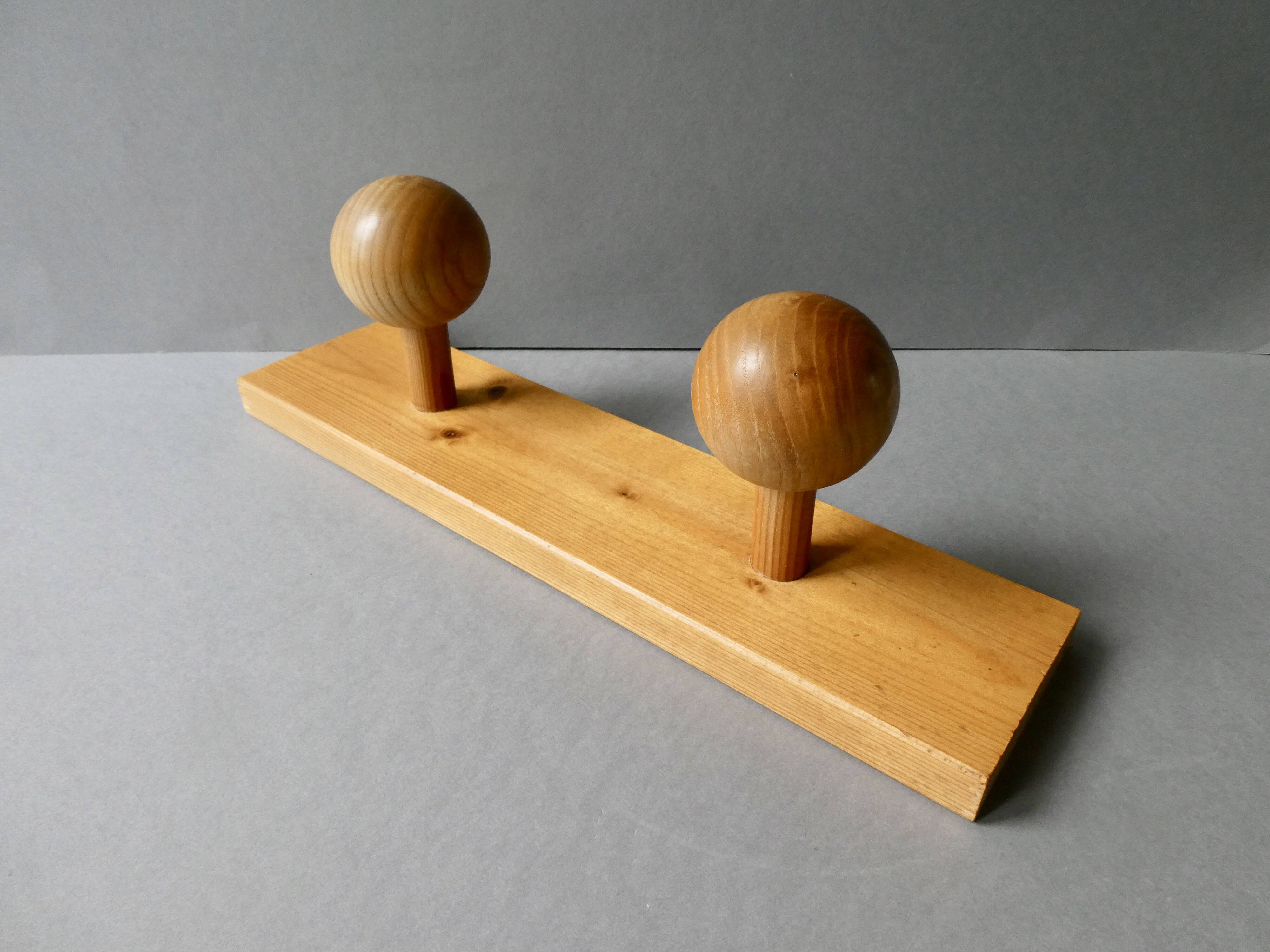 Wall coat rack with 2 pine ball hooks