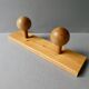 Wall coat rack with 2 pine ball hooks
