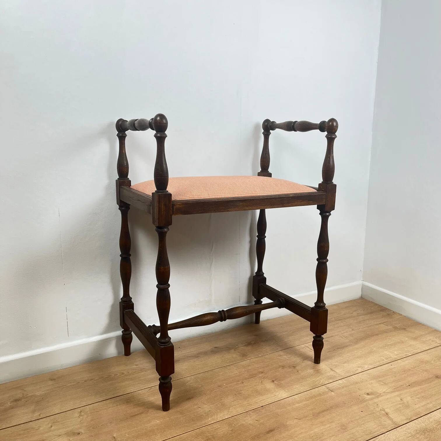 Small bench / stool in traditional English style, with side armrests.