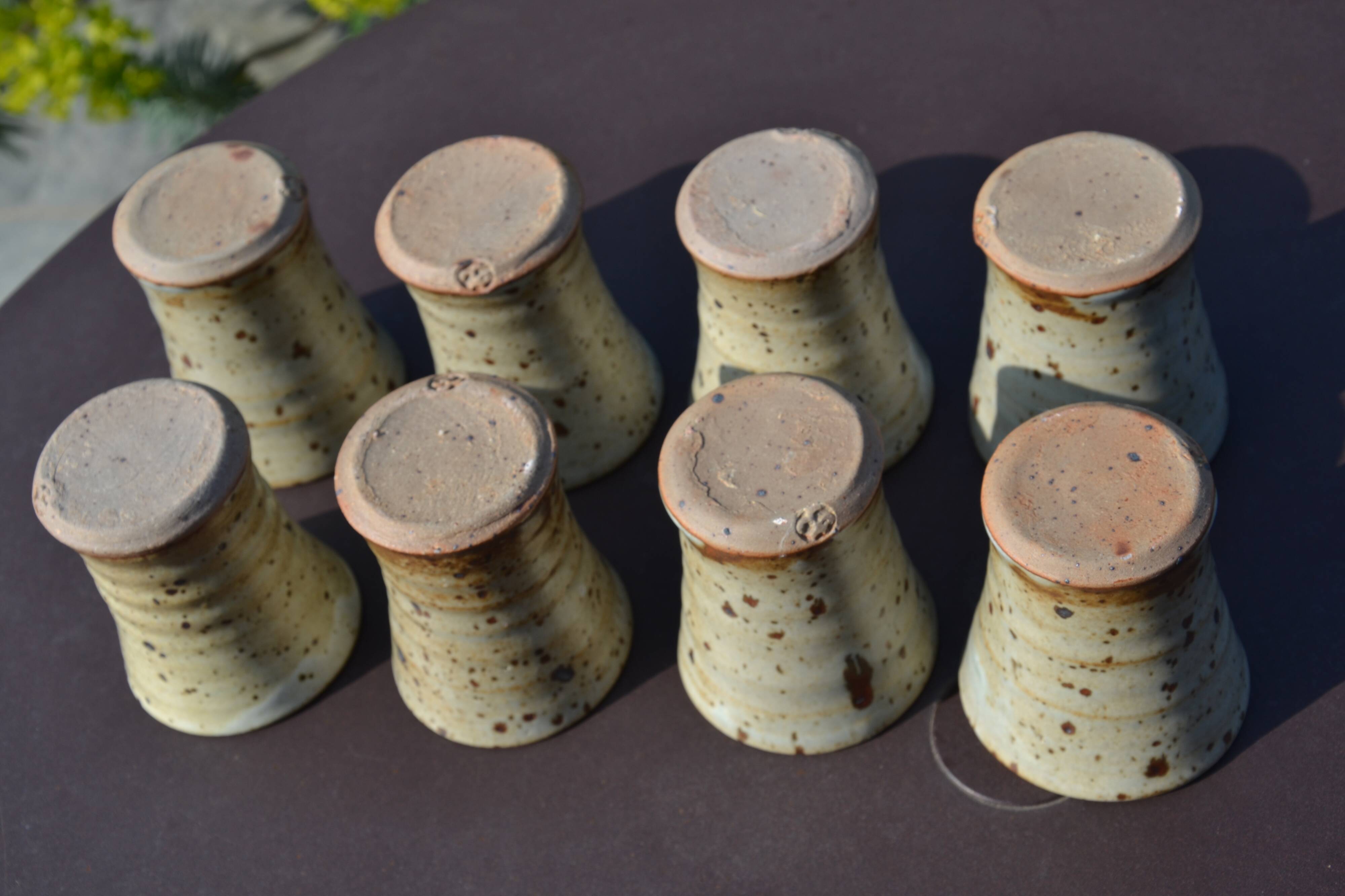 8 stoneware cups/mugs by Gustave Tiffoche