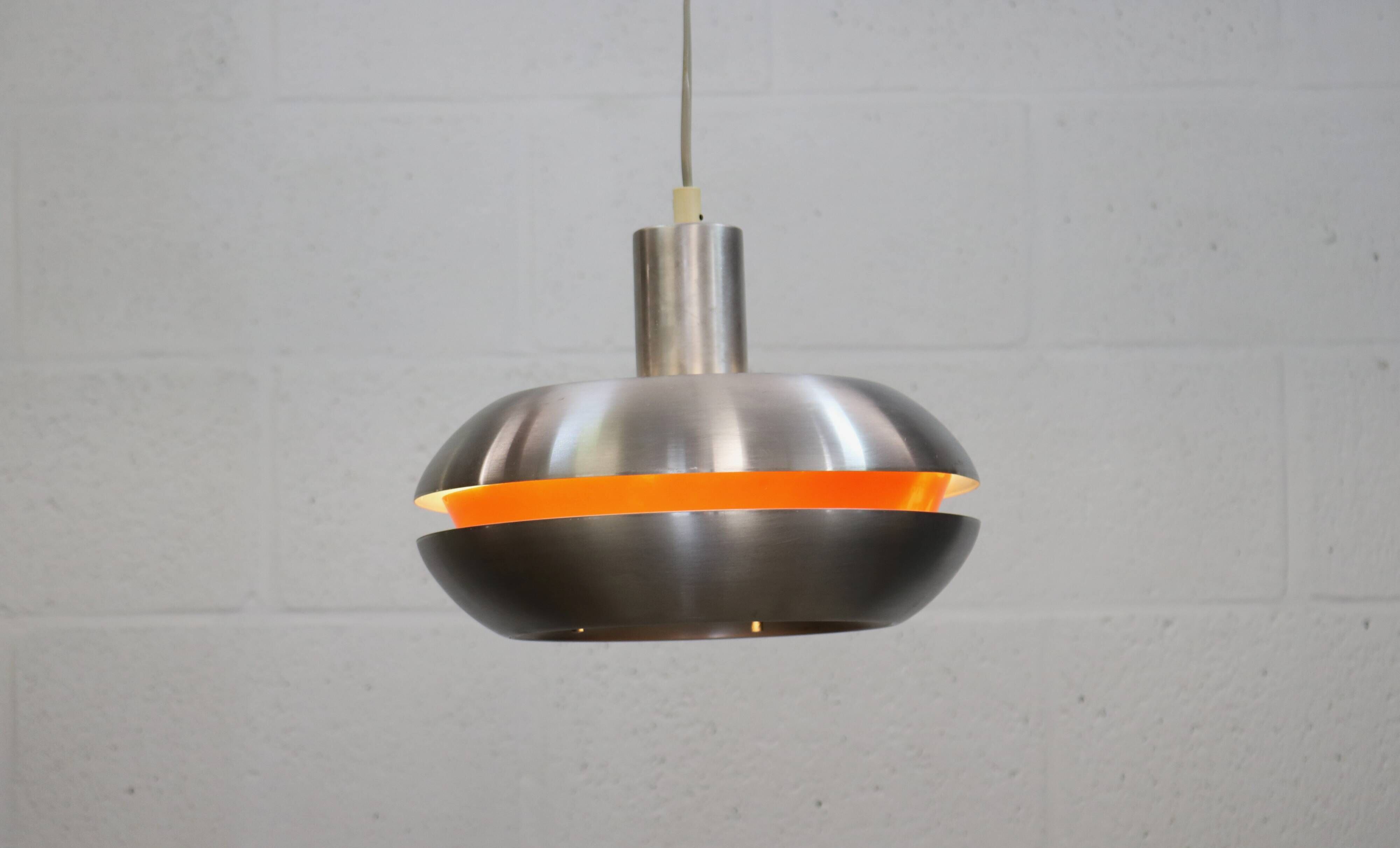 Old Danish space age design lamp in alu and orange inside.