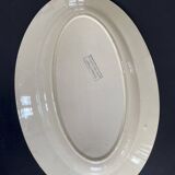 Oval plate Moulin des Loups in blue and red ceramic with a floral design.