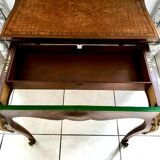 Console transforming into a 19th century Louis XV style gaming table