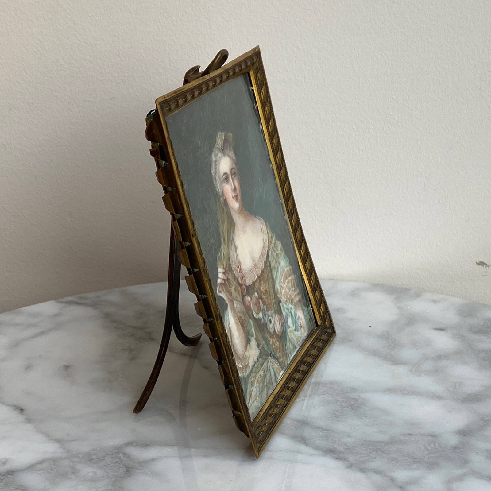 19th-century miniature depicting an 18th-century woman, bronze frame