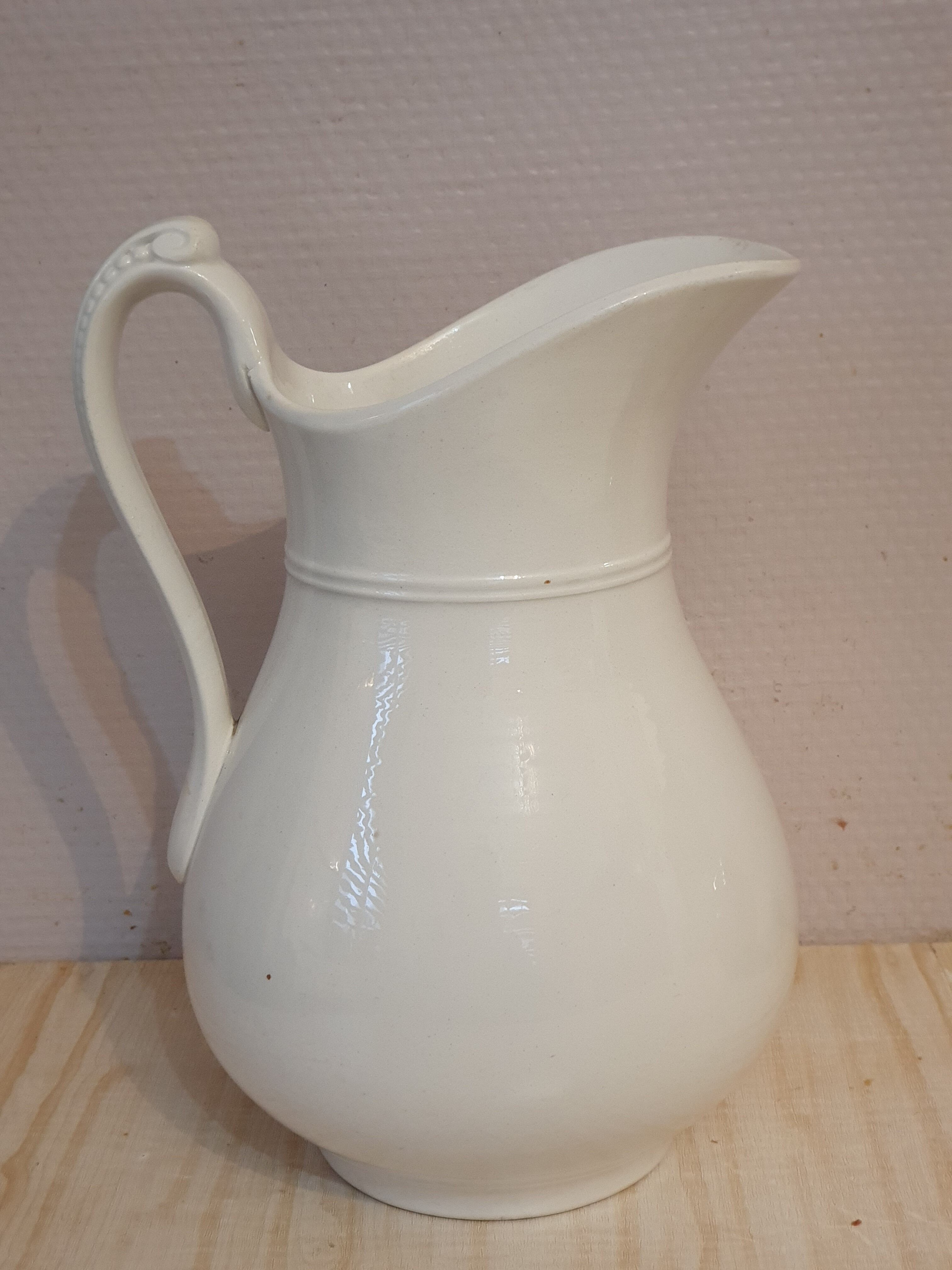 Antique pitcher pitcher in white porcelain