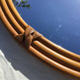 Natural rattan oval mirror bound