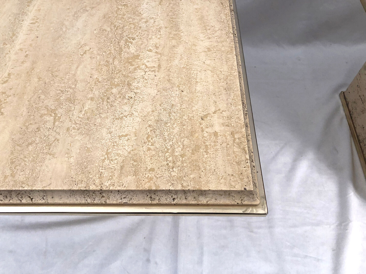Pair of sofa ends in travertine