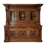 Two-body buffet, made of richly carved solid walnut.