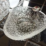 Two molded glass cups in the shape of strawberry and pineapple