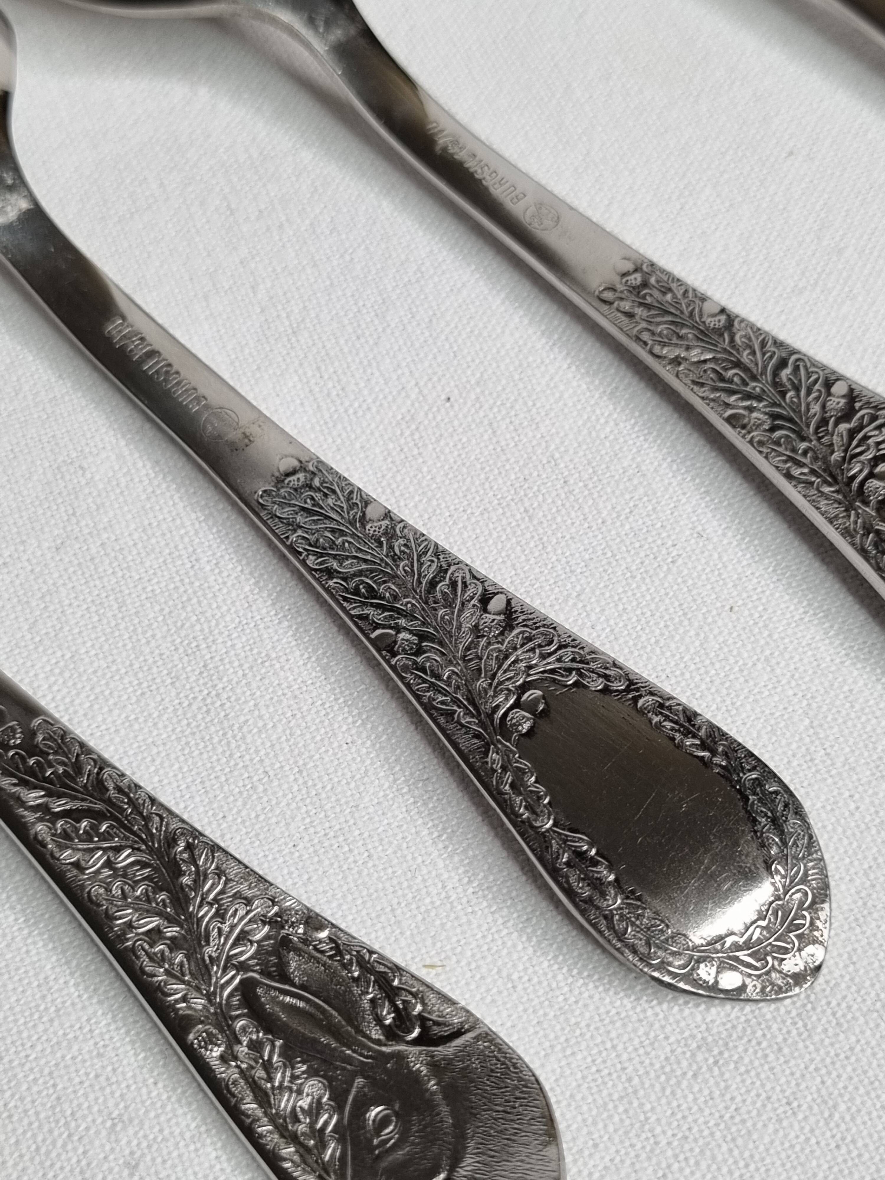 Set of six "Burgsil" stainless steel teaspoons with rabbit decoration