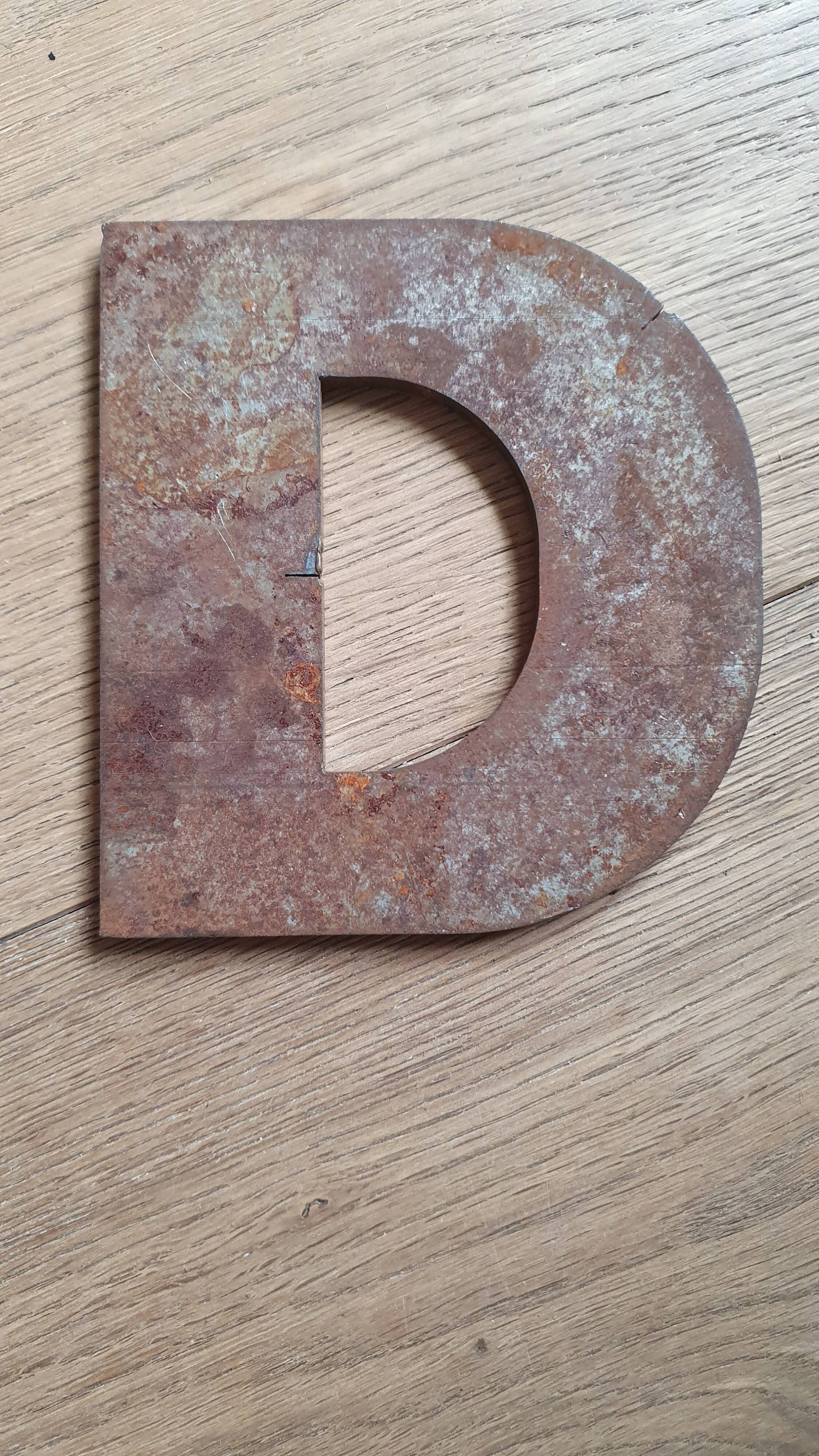 Metal letter D