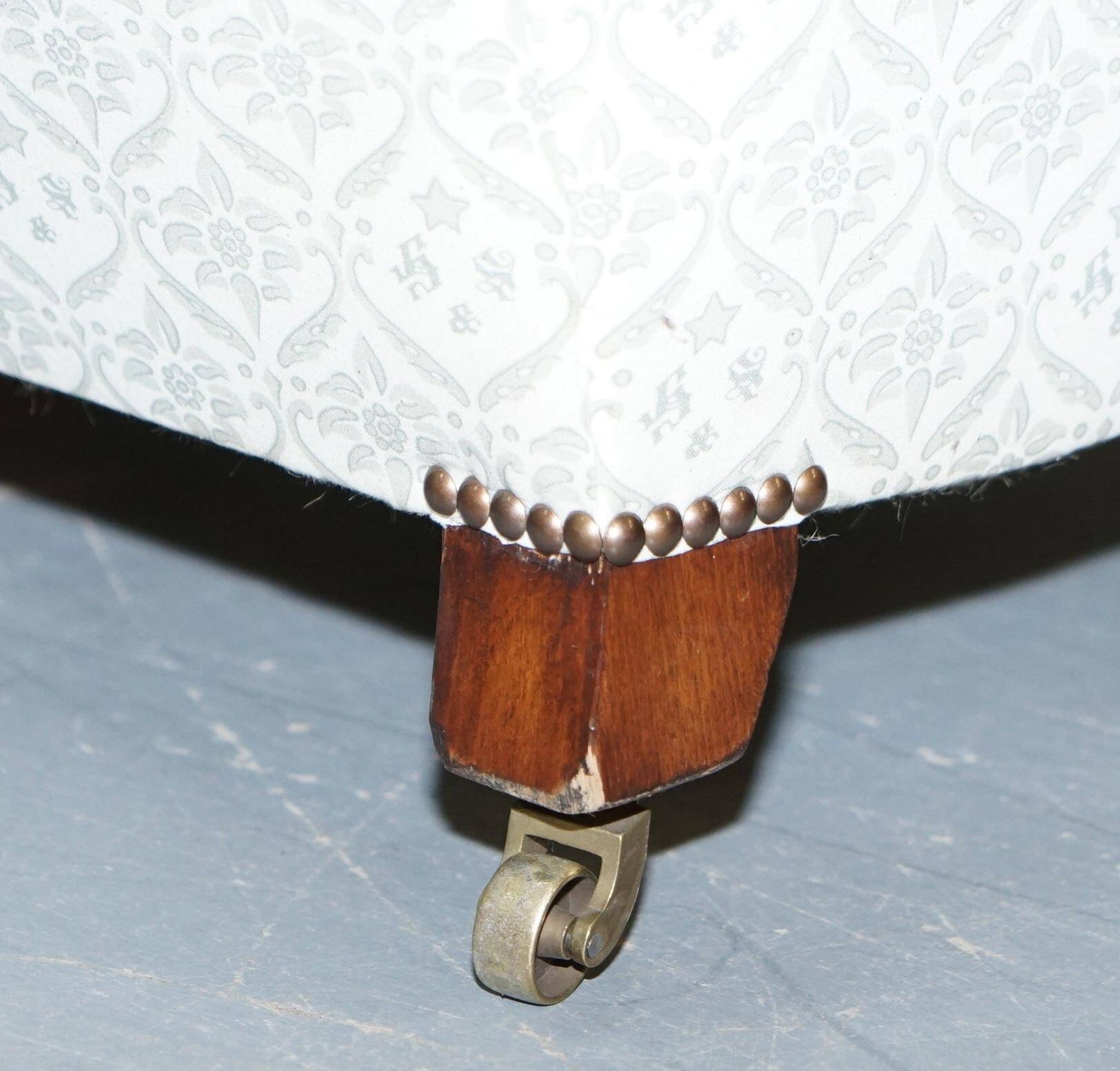 Howard & Sons canapé with feather cushions and ticking fabric, Victorian style.