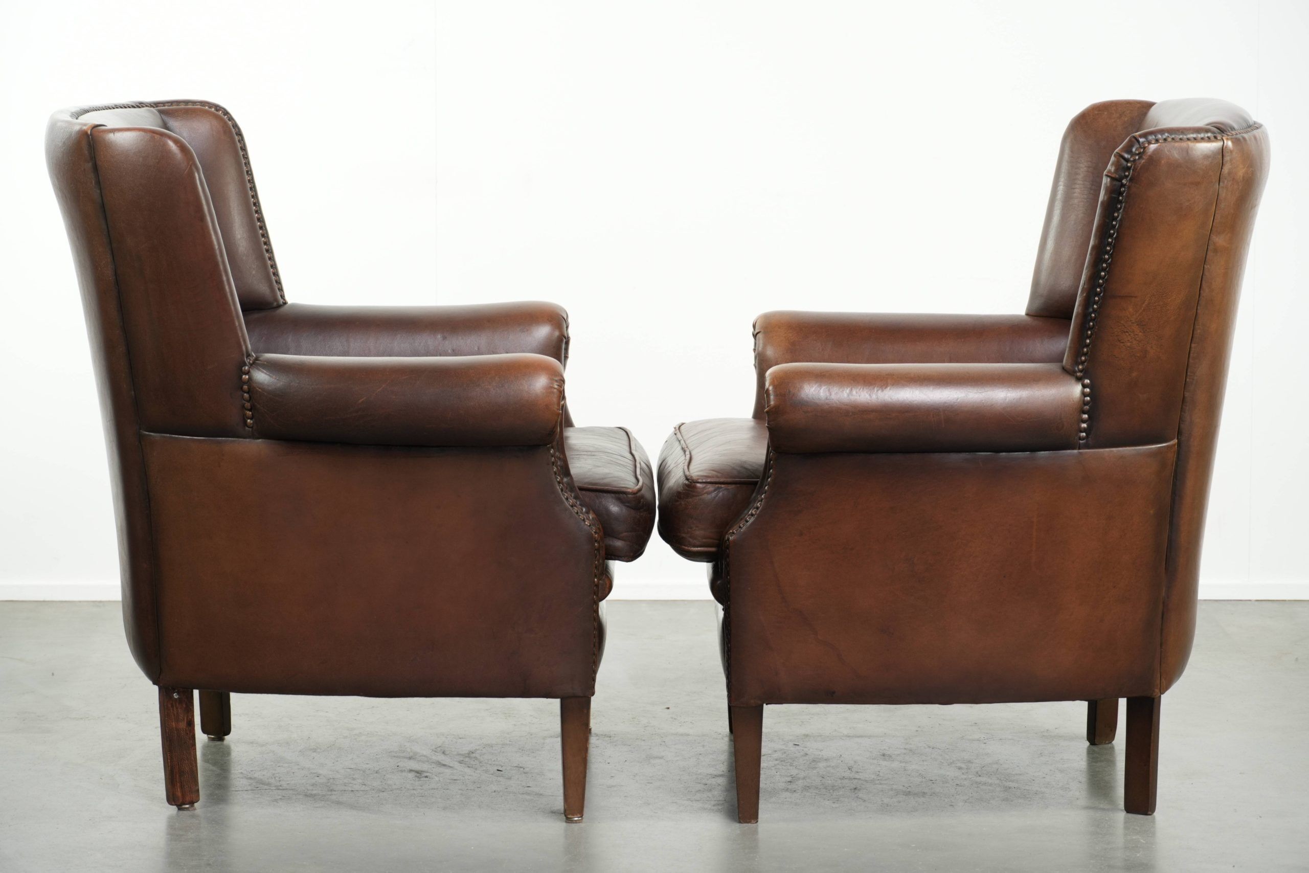 Set of 2 subtle sheepskin wingback armchairs in English style