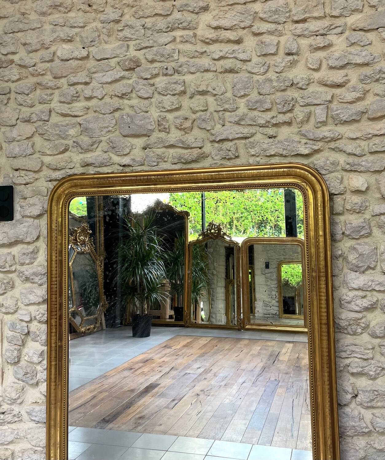 Louis-Philippe mantel mirror 133cm/115.5cm beaded gilded with gold leaf geometric decoration, late 19th century, heavily pitted and scratched glass, parquet on the back.