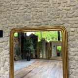 Louis-Philippe mantel mirror 133cm/115.5cm beaded gilded with gold leaf geometric decoration, late 19th century, heavily pitted and scratched glass, parquet on the back.