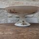 Flat serving compote dish in Terre de Fer HB & Cie with brown floral decoration.