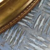 Antique oval mirror in gilded stucco with gold leaf, 19th century