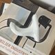 An antique white porcelain coat hook towel holder.