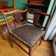 Corner armchair in wood and leather art deco style