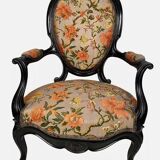 Pair of Napoleon III armchairs, in blackened wood, floral patterned fabric