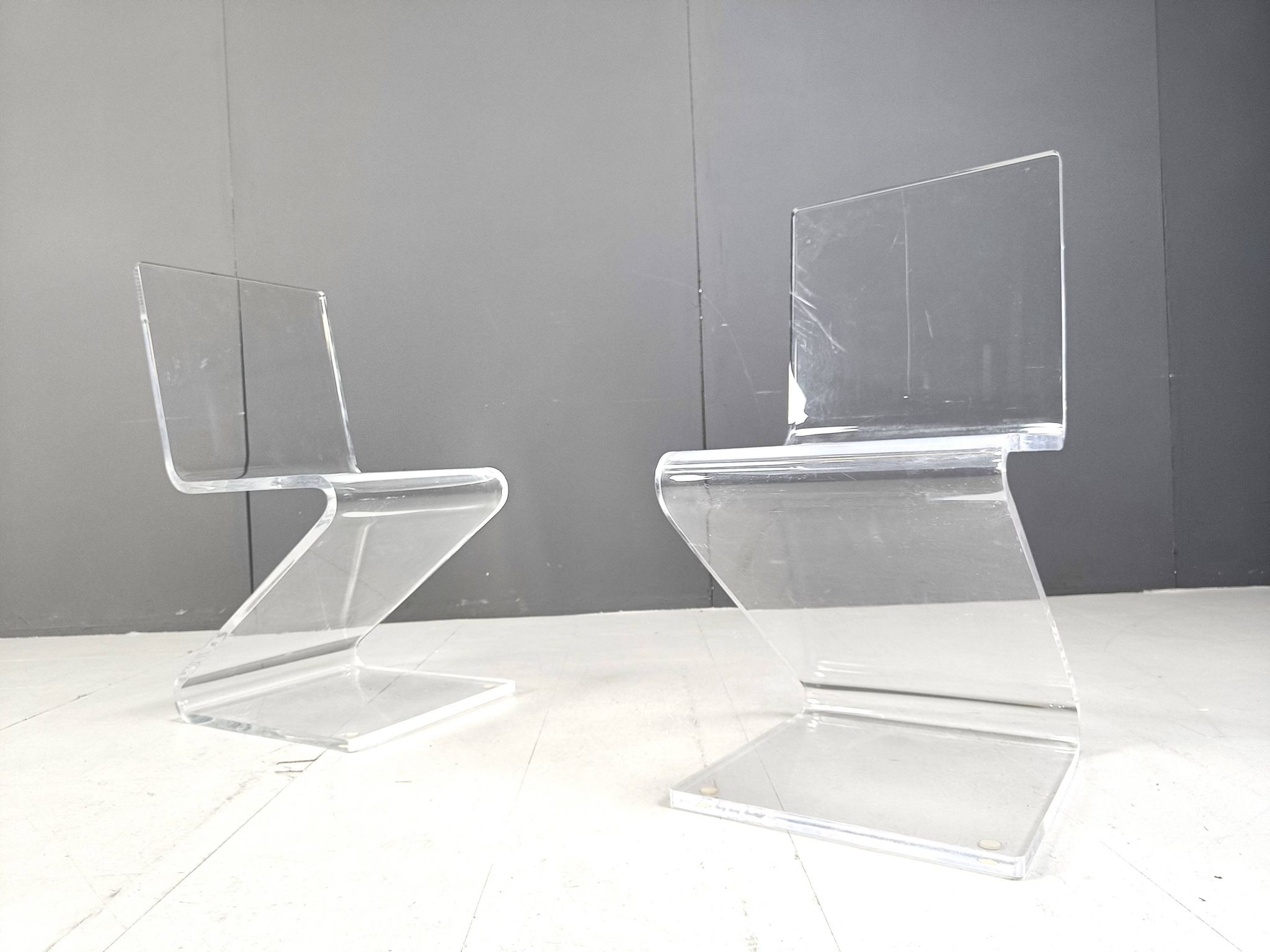 Pair of lucite zigzag dining chairs, 1980s