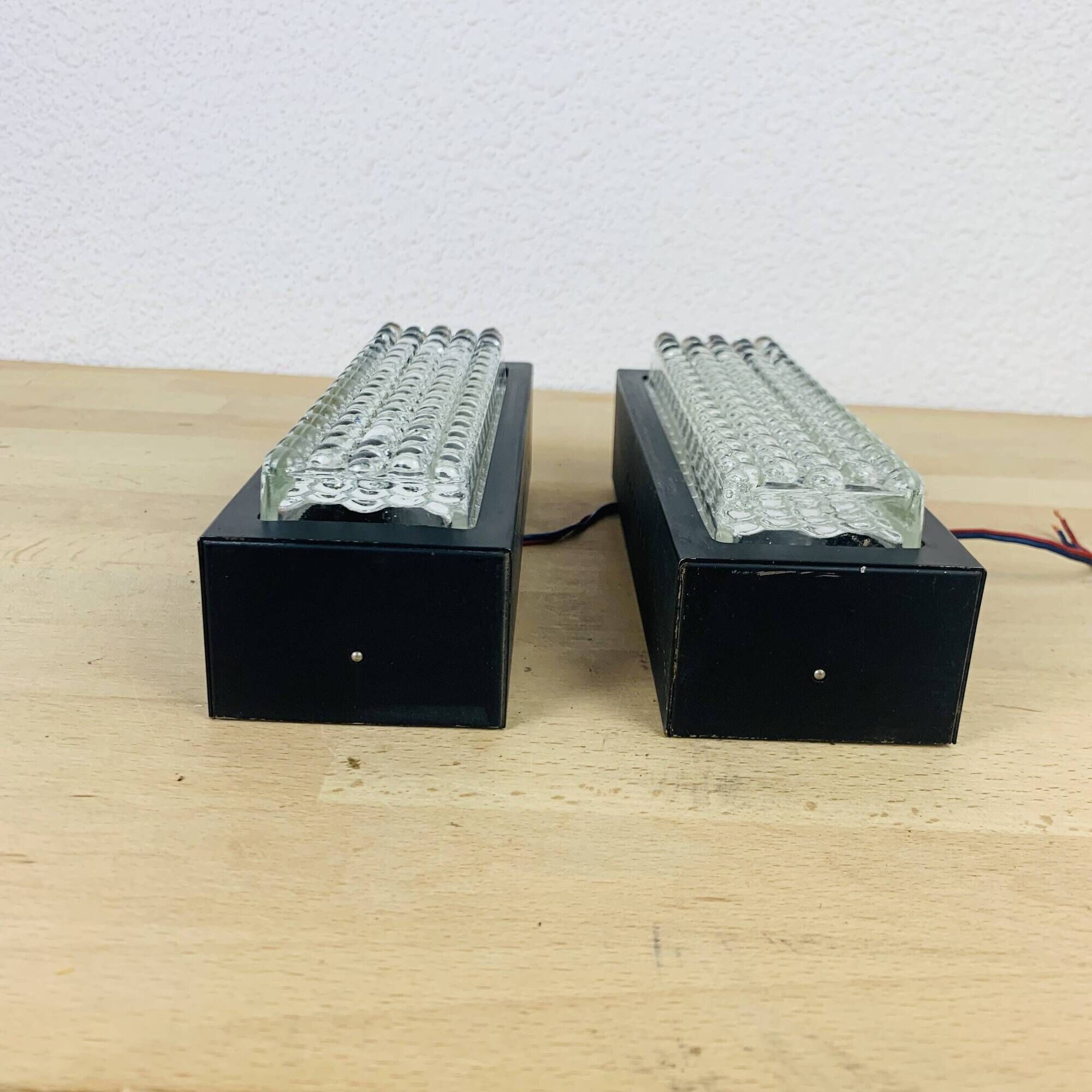 Pair of molded glass and metal wall lights from the 1950s