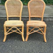 2 rattan and caned chairs in colonial bistro style from the 1990s.