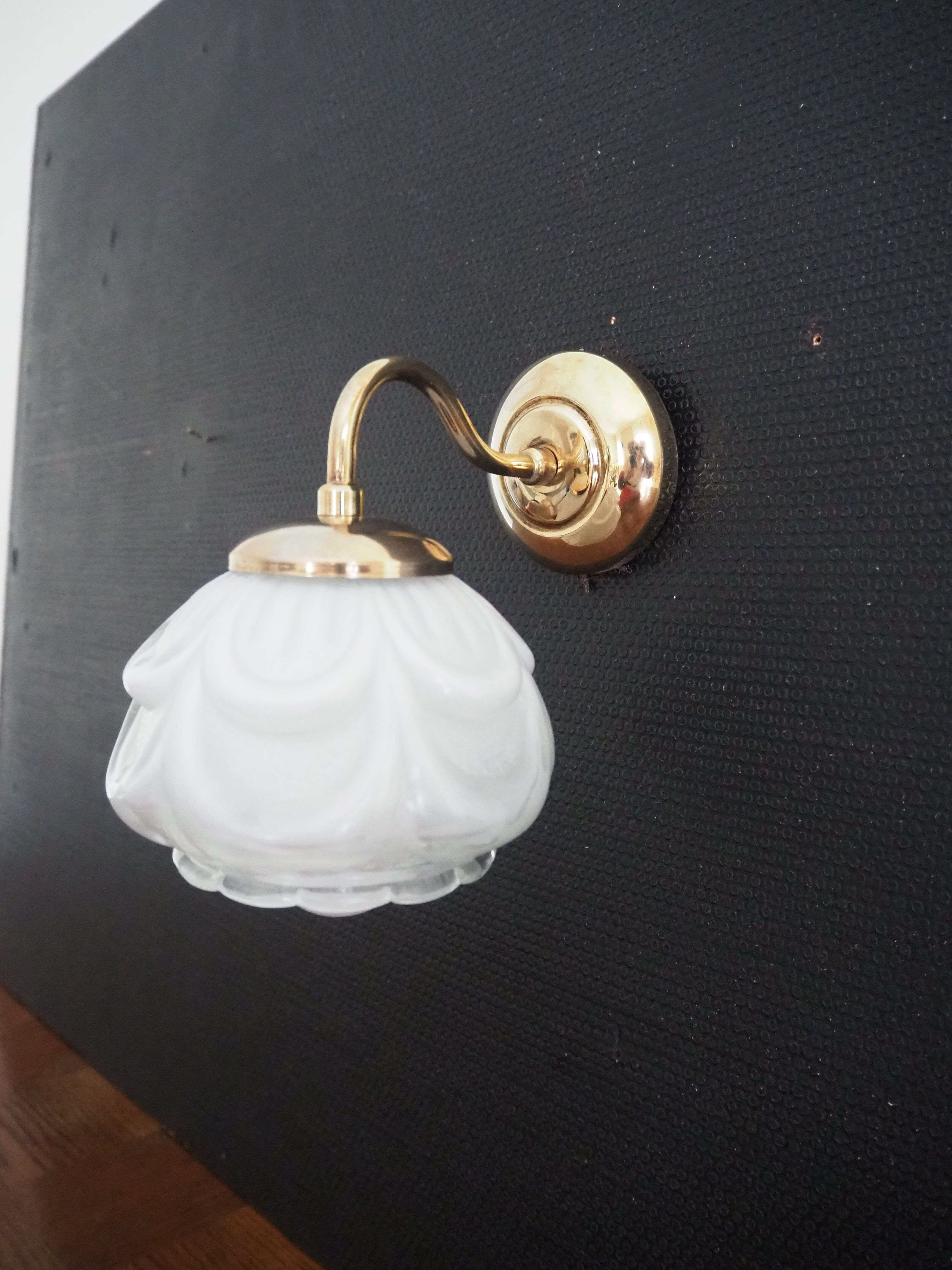 Brass wall lamp and white glass globe from the 1950s-1960s.
